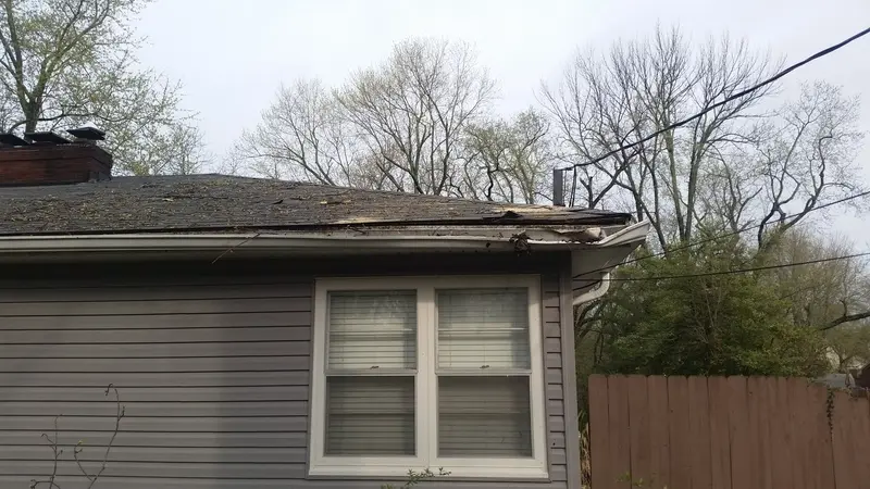 peeled roof by the corner of a house